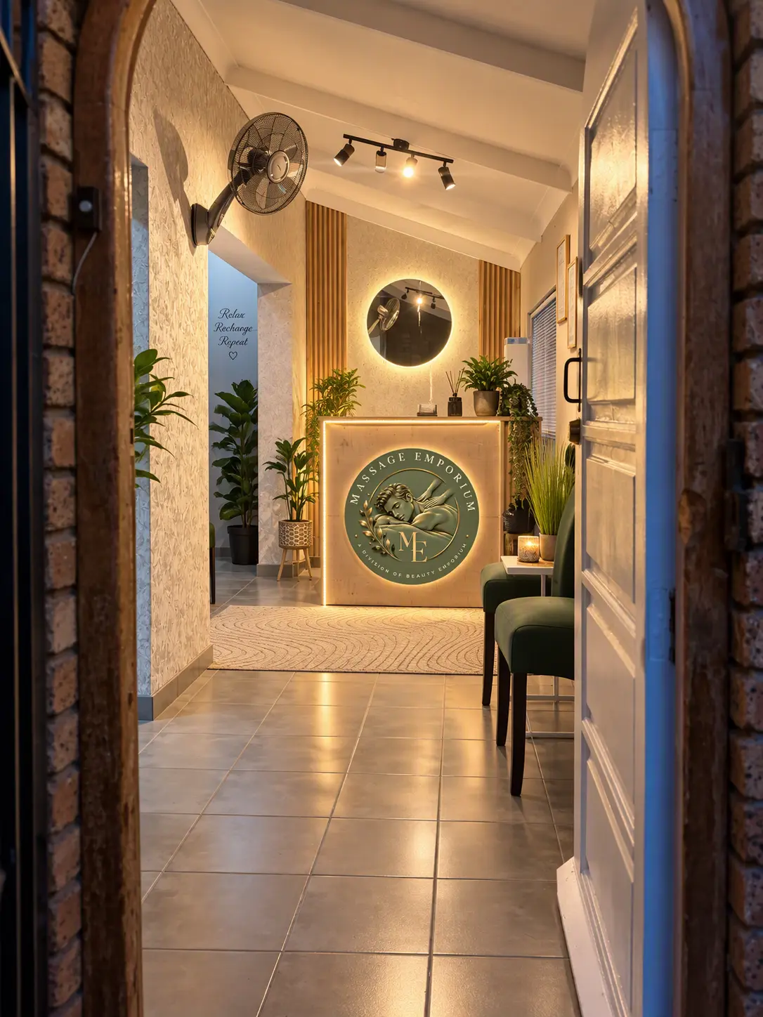 Massage Emporium entrance and warmly lit reception with the original counter logo